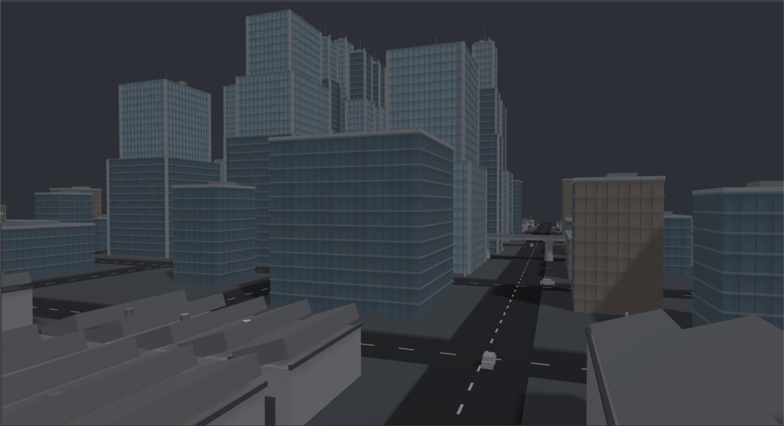 A city blocked in with simple gray geometry in the three.js IDE: mid-rise blocks, towers behind, an avenue running to the horizon